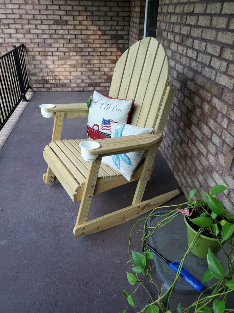 Finished wooden rocking chair with full rockers, cup holders, and Cabot-ready finish